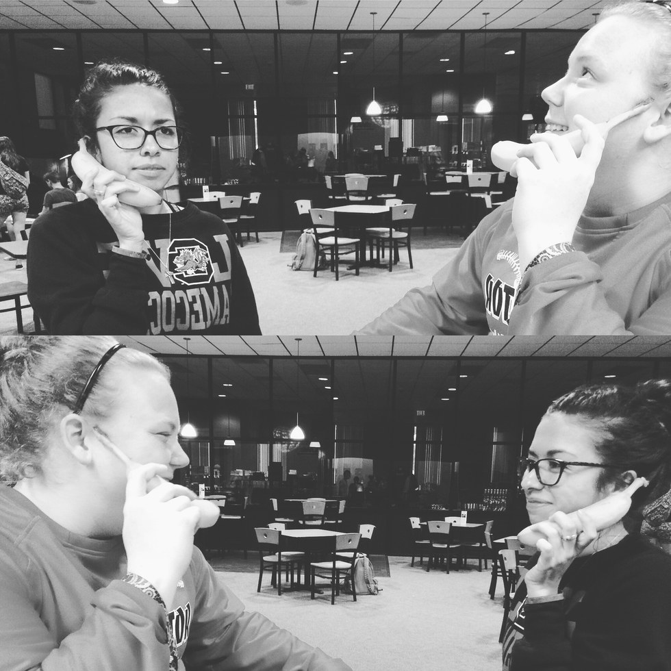 Two students having fun in the campus coffee shop